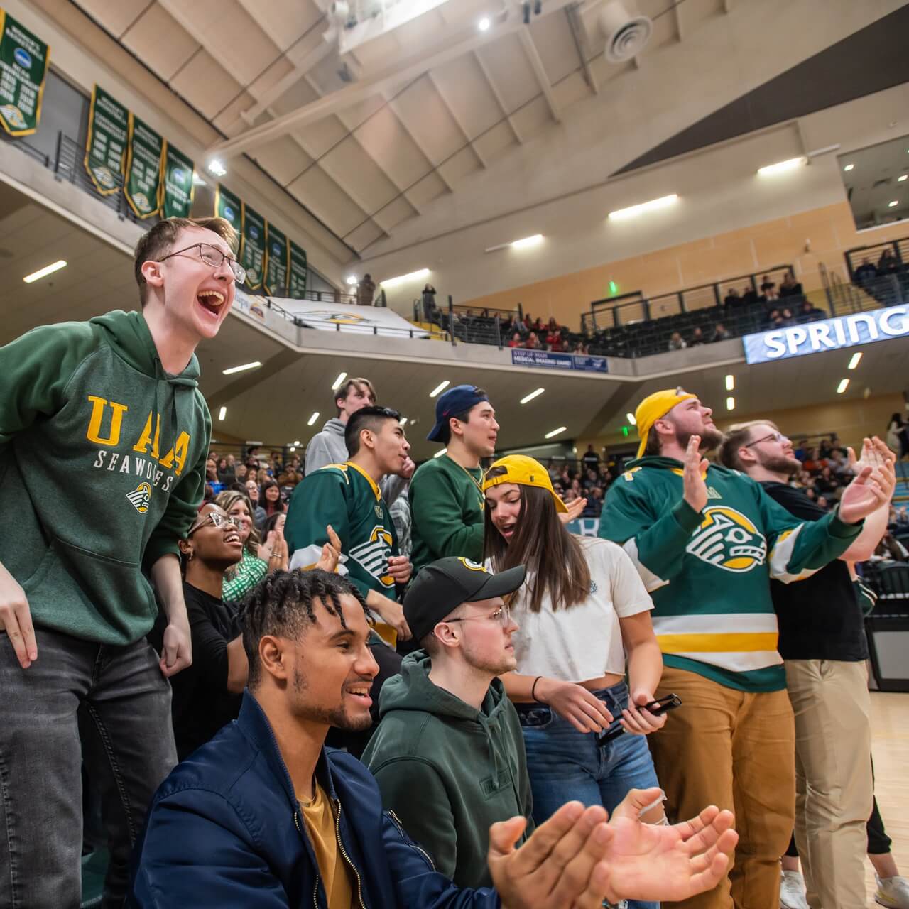UAA Volleyball players celebrating