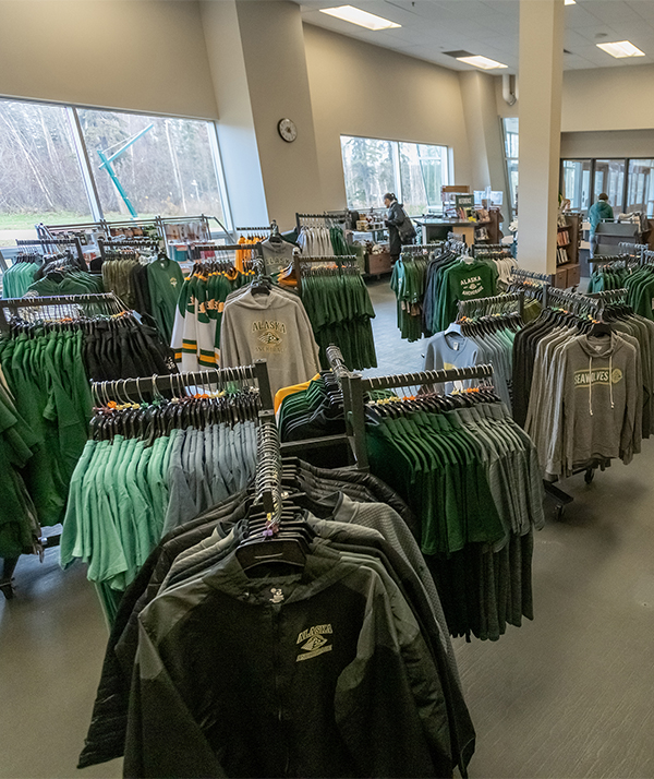 Bookstore interior with UAA-branded gear.
