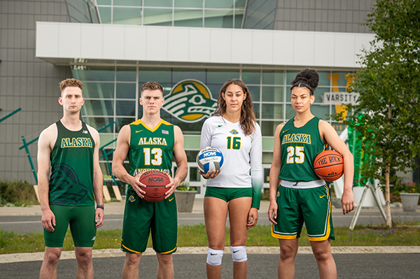 UAA Alaska Airlines Scholar-Athletes Daryl Bushnell, from Seawolves Track and Field/Cross Country, Tobin Karlberg, from Seawolves Men's Basketball, Eve Stephens, from Seawolves Volleyball, and Tennae Voliva from Seawolves Women's Basketball, photographed at the Alaska Airlines Center.