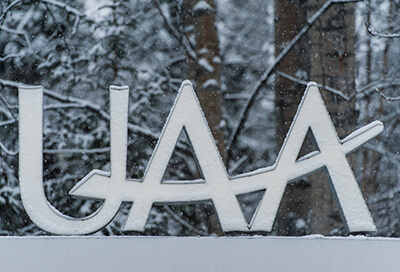 UAA sign in fresh snow.