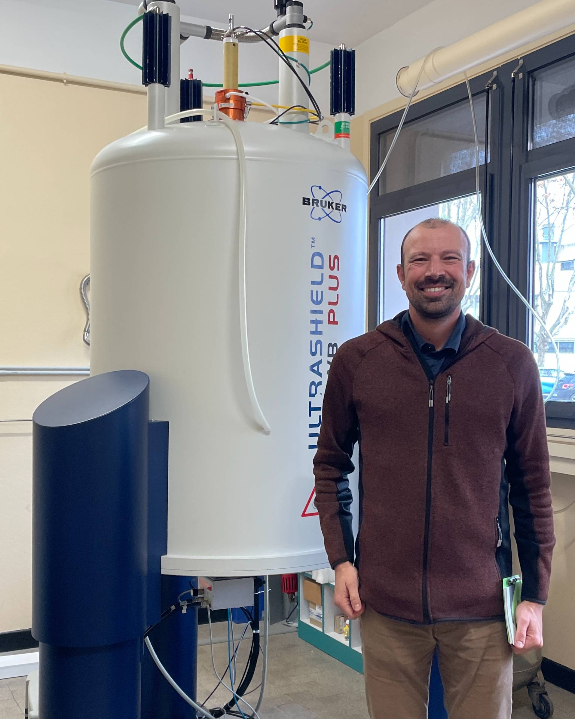 Pat Tomco with a Nuclear Magnetic Resonance (NMR) spectrometer 