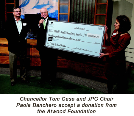 Chacellor Tom Case and JPC Chair Paola Banchero accept a donation from the Atwood Foundation.