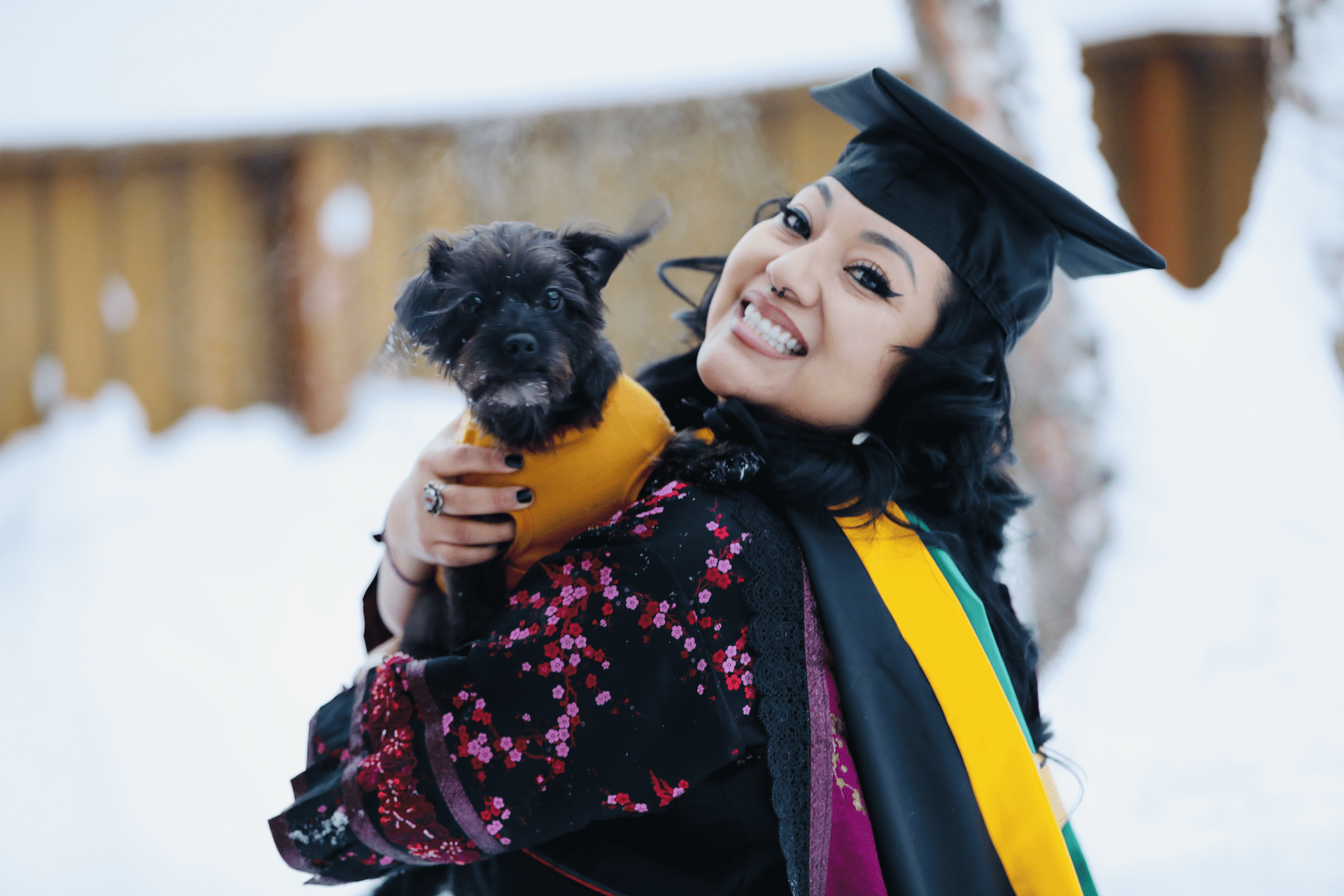 Maredyth Salazar headshot with pet dog Norma