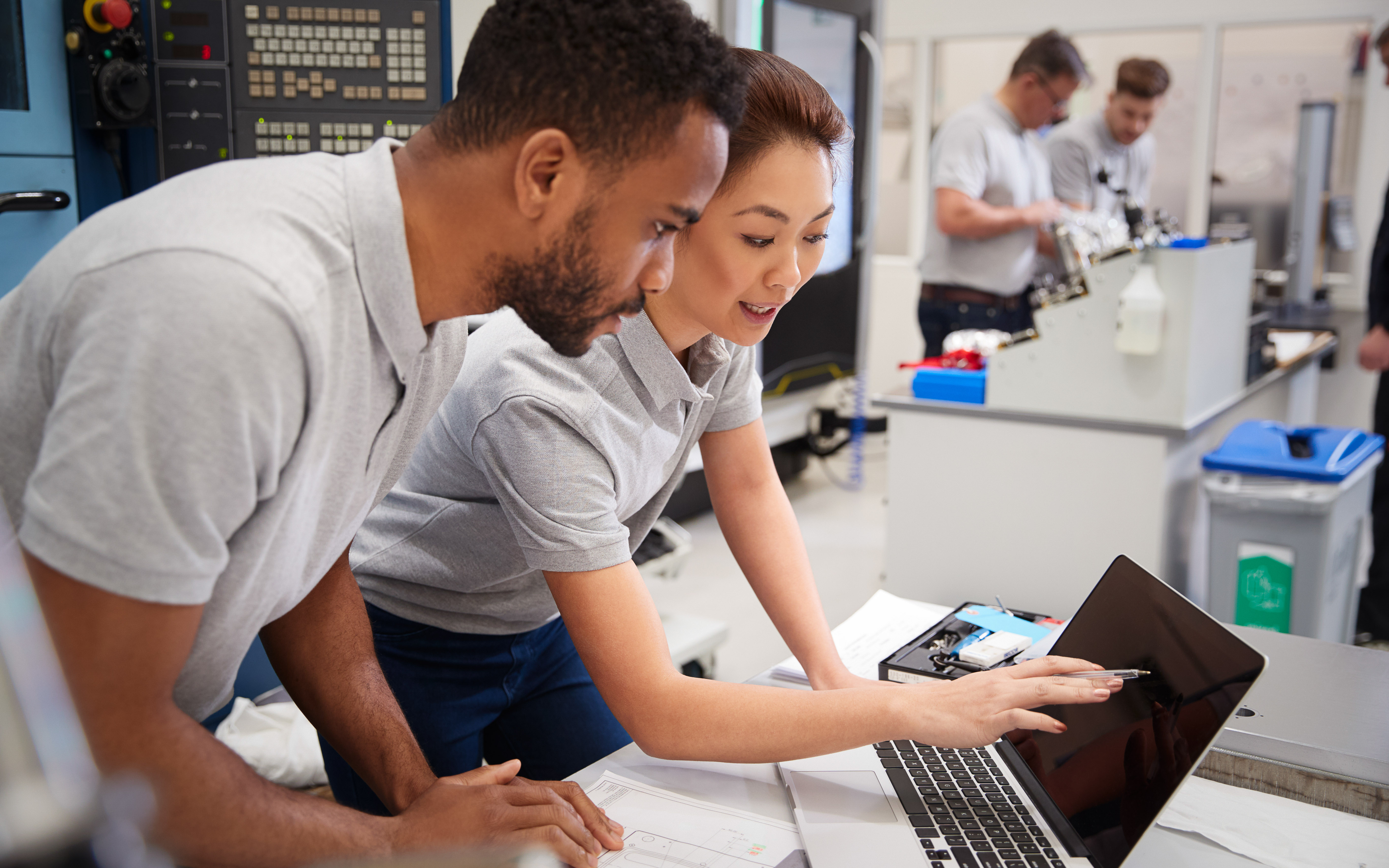 two software engineergs looking at a computer screen