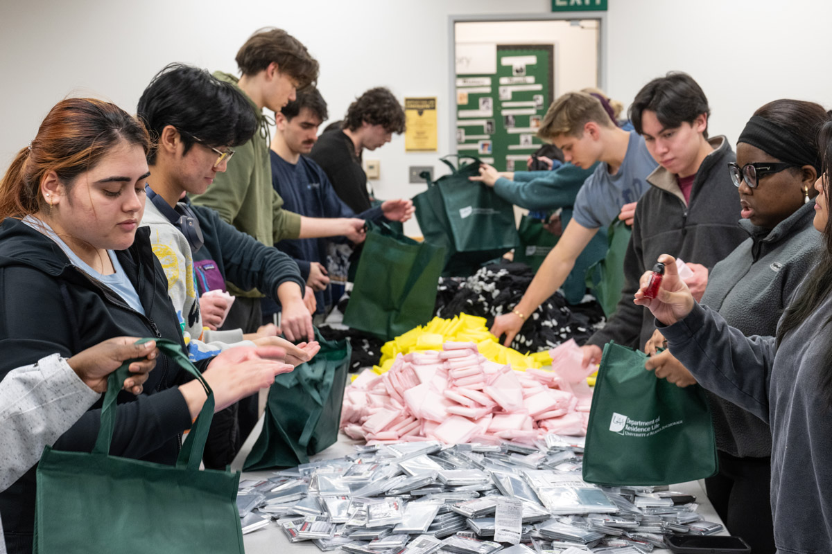 Students packing supplies into bags