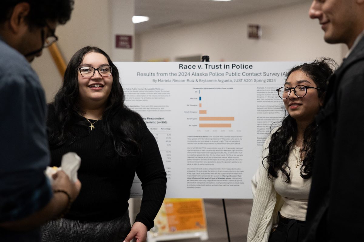 UAA Justice Center junior Anafusi Fangatua chats with her professor, Ingrid Johnson, in UAA's Parrish Bridge