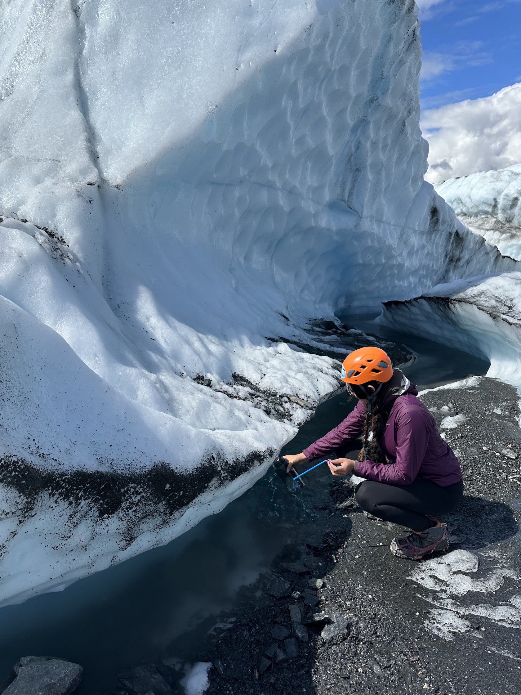 Dakota Ramirez filling up her water bottle at Matanuska Glacier