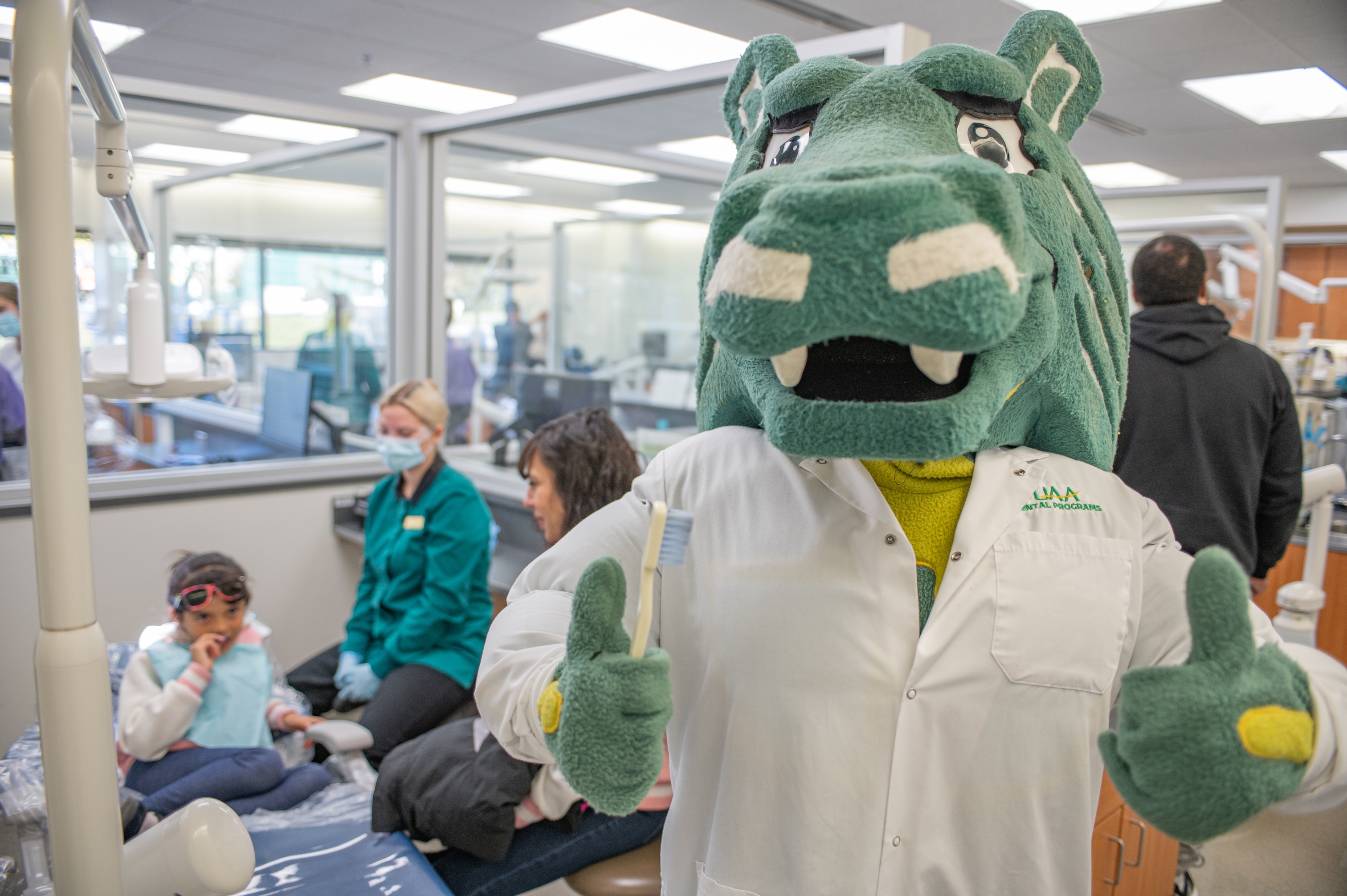 Spirit smiles for the camera at UAA Dental Clinic 