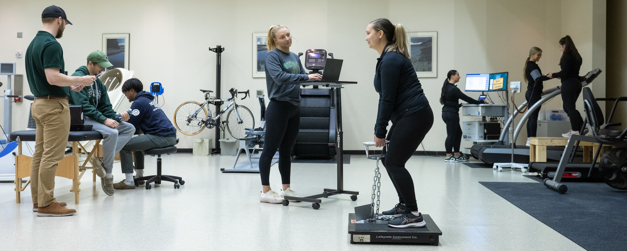 Students in the human performance lab practice administering tests