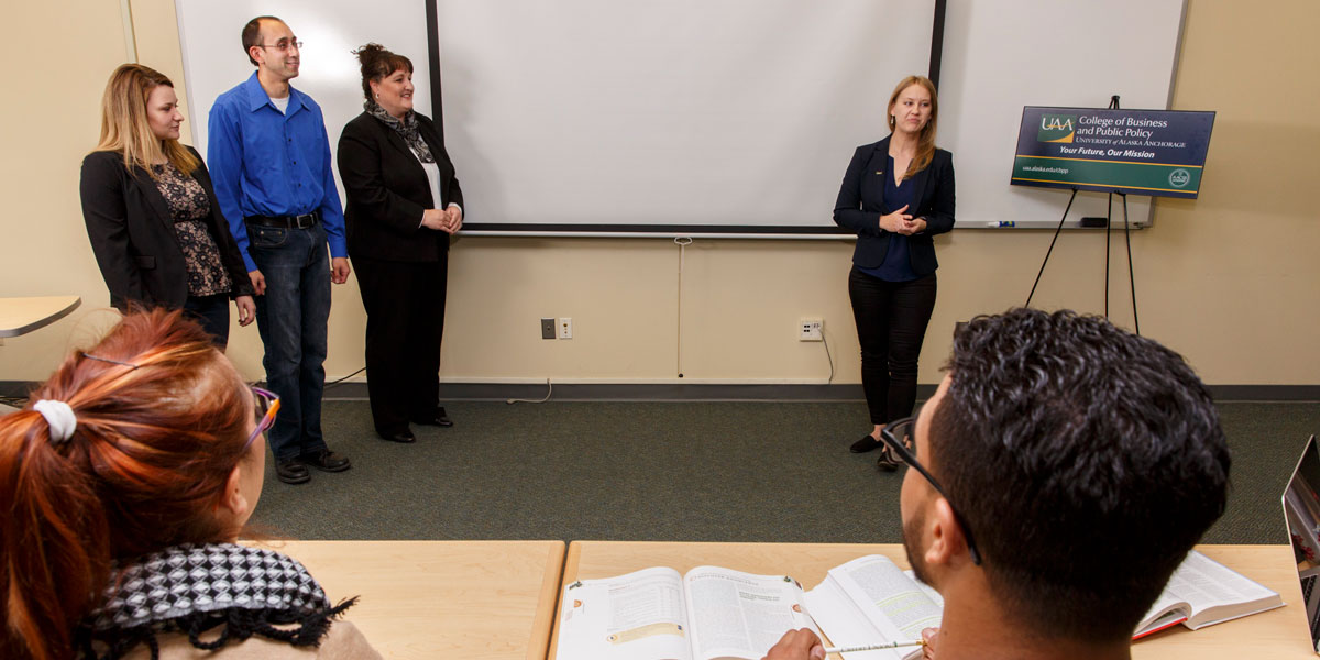 Students presenting in front of a class