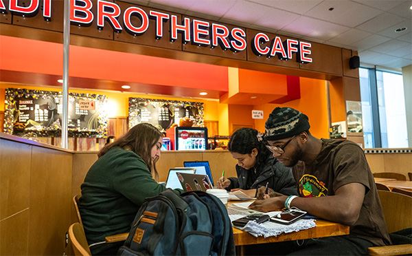 Students studying in the Kaladi Brothers Cafe in UAA's Social Sciences Building.