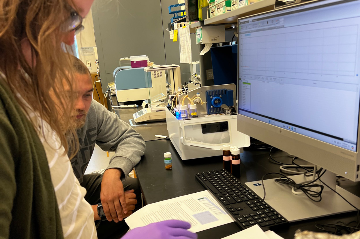 Two scientists working on a computer