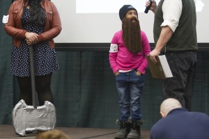 8-year-old Sena Dooley--sporting a Duck Dynasty hat and yarn beard--won the fake beard category at this year's Beard and 'Stache Competition (Photo by Philip Hall/University of Alaska Anchorage).