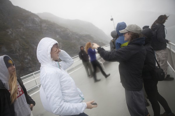 Students crowd the deck on a wet weekend boat tour across Portage Lake (Photo by Philip Hall / University of Alaska Anchorage). 