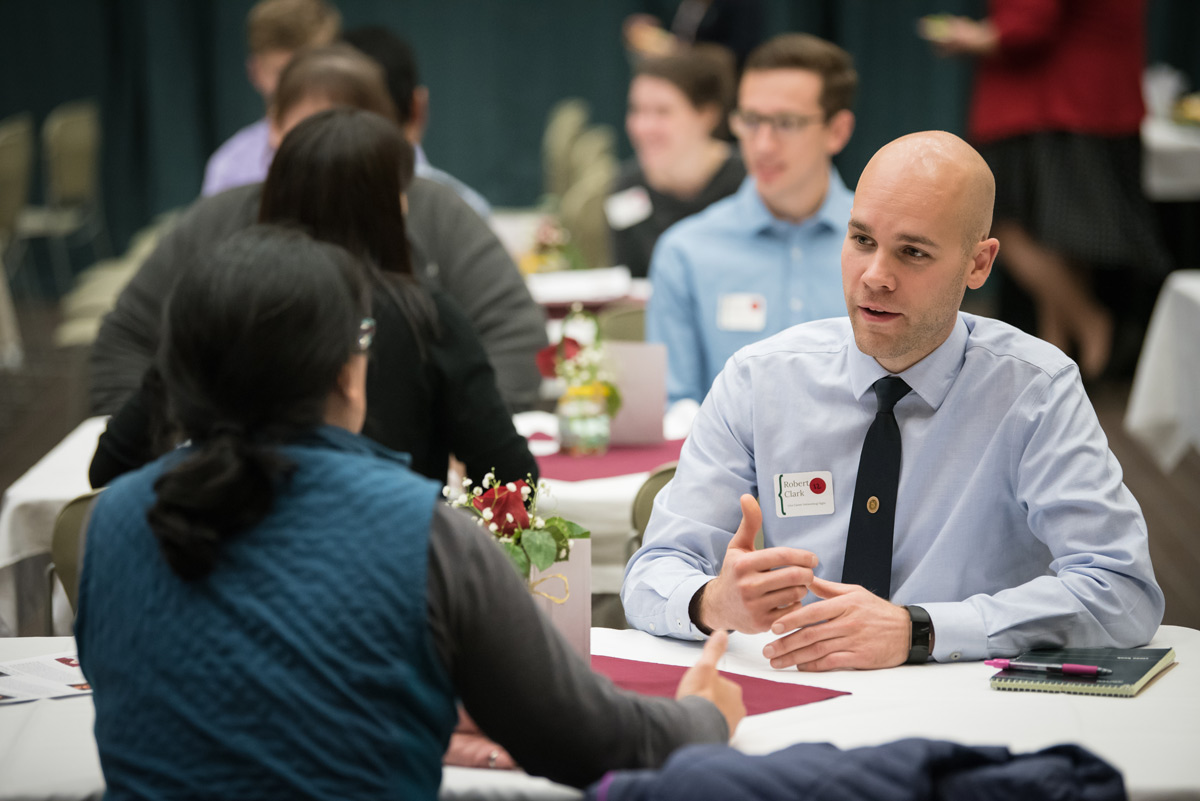 Robert Clark gets advice from mentors during the speed networking portion of Career Networking Night in UAA's Student Union.