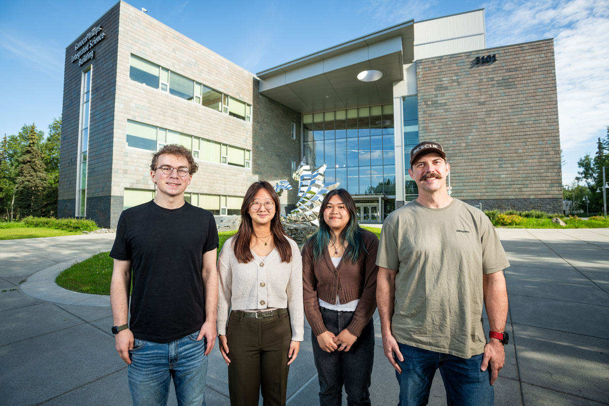 The initial cohort of UAA and WWAMI's new NIH-funded Biomed U-RISE program, photographed outside UAA's ConocoPhillips Integrated Science Building. From left: Bryce Inman, Hanna Whang, Alyssa Samson, and Steven Cherry.