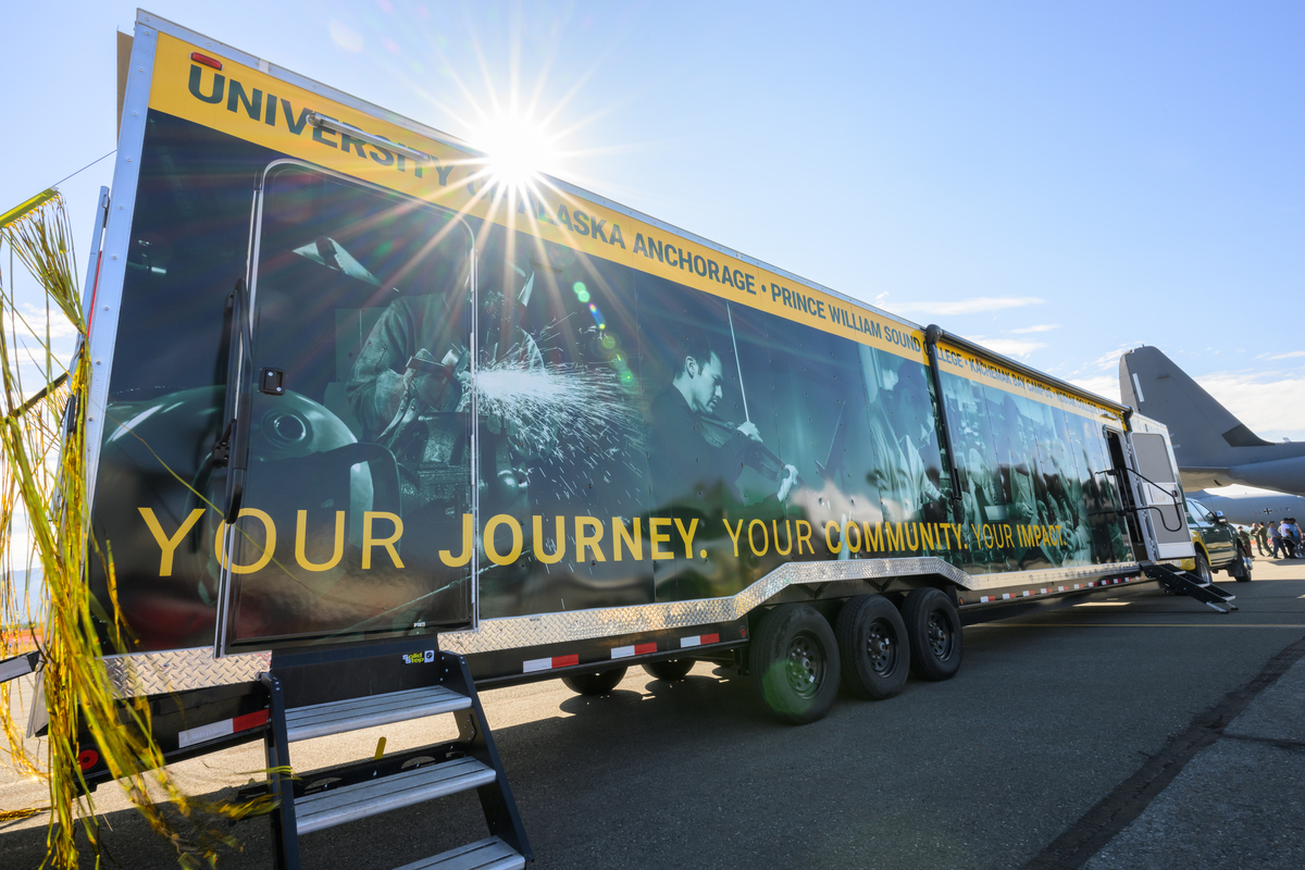 UAA's MobileGo trailer unit adorned with the new tagline: Your journey. Your community. Your impact.