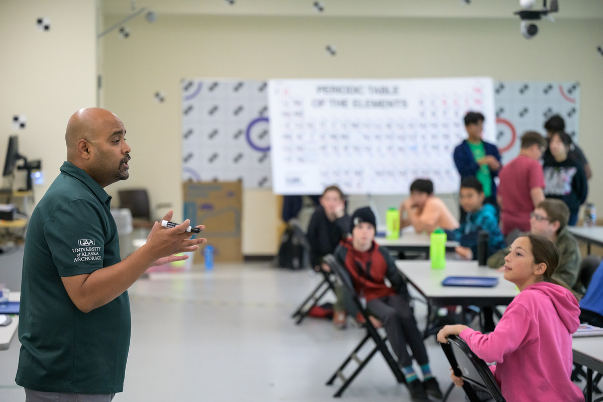 UAA mechanical engineering professor Raghu Srinivasan teaches a UAA Summer Engineering Academy for middle school students focusing on corrosion chemistry in UAA's Engineering and Computation Building.