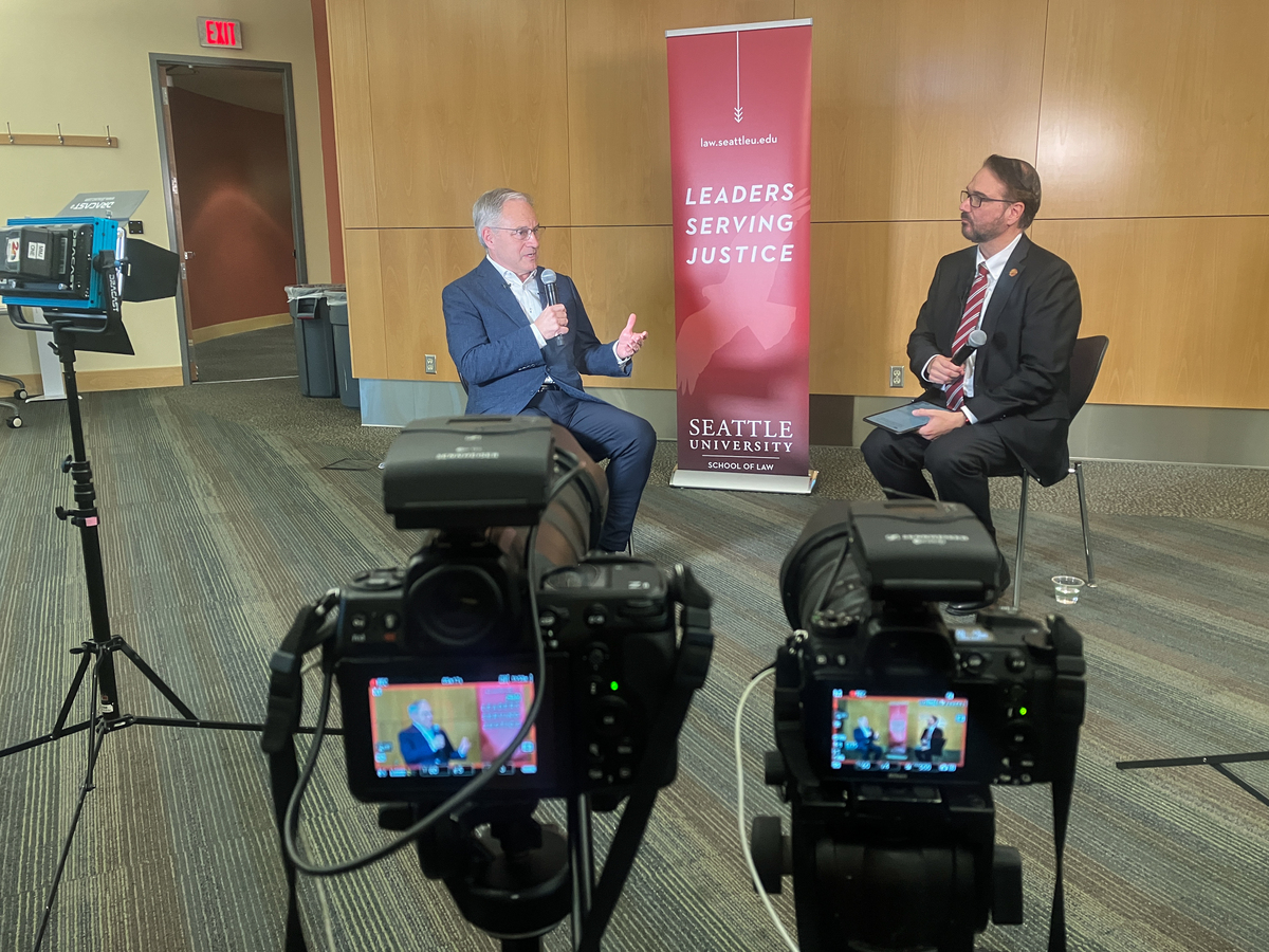 UAA Chancellor Sean Parnell is interviewed by Seattle U Law Dean Anthony E. Varona for a podcast as Seattle U Law announces its new Hybrid Hub at UAA during an event in the Consortium Library.