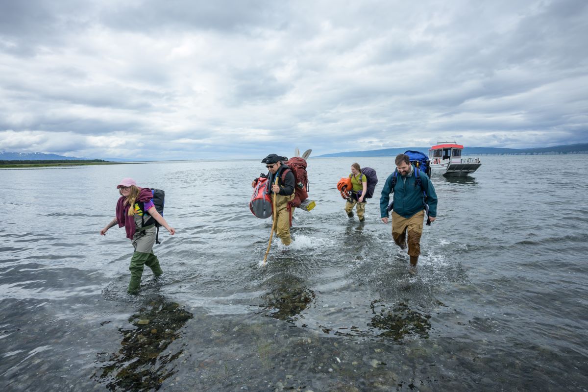 The team disembarks after crossing Kachemak Bay in a water taxi 