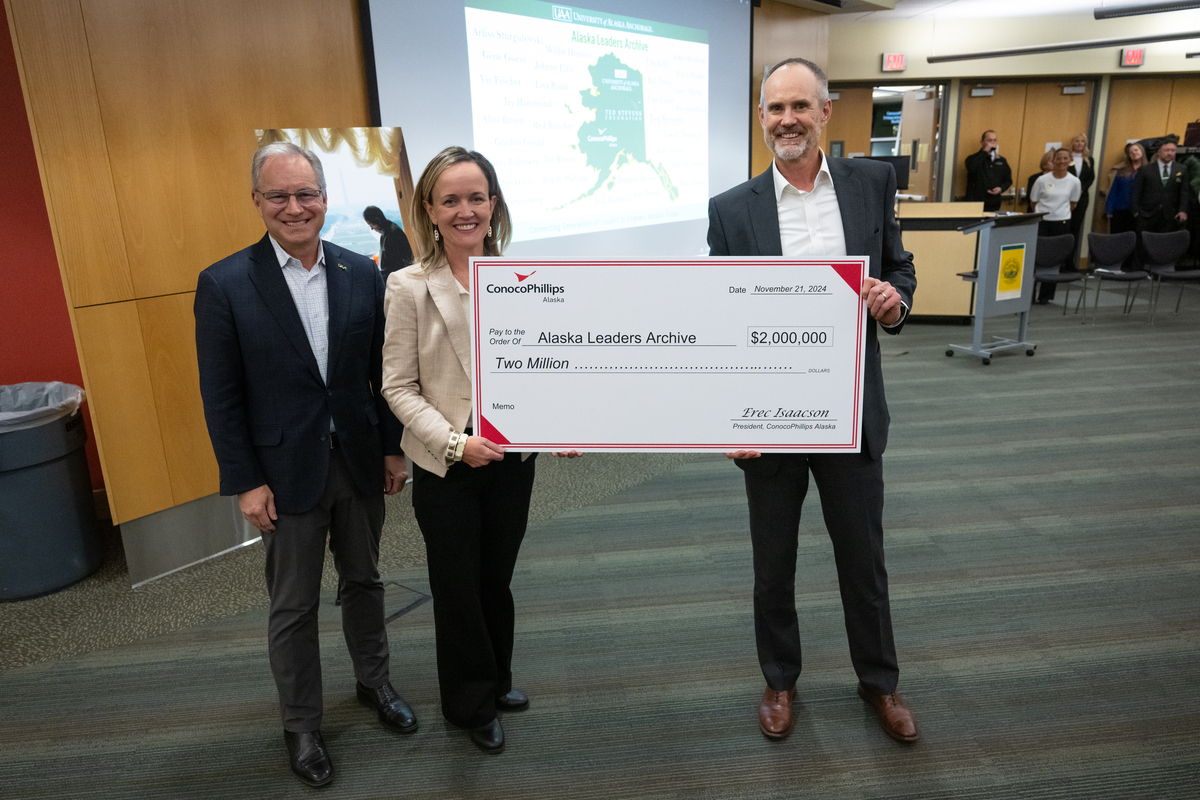 Chancellor Sean Parnell,  Lily Stevens Becker, Sen. Stevens’ daughter and executive director of the Ted Stevens Foundation, and ConocoPhillips Alaska President Erec Isaacson with a check as UAA announces a $2 million donation from ConocoPhillips Alaska to the Ted Stevens Foundation to create the Alaska Leaders Archive at the UAA/APU Consortium Library.