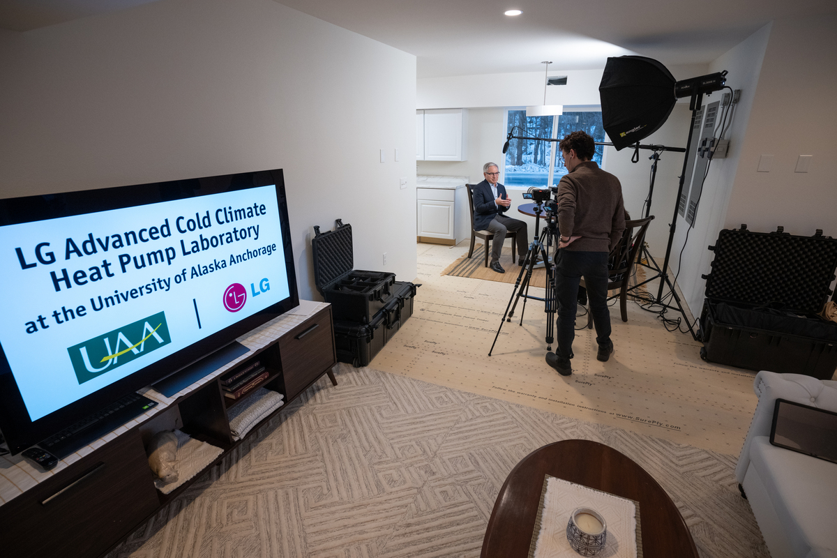 Chancellor Sean Parnell is interviewed by a PR team from LG inside the new lab before the ribbon cutting for the UAA College of Engineering's LG Cold Climate Heat Pump Lab.