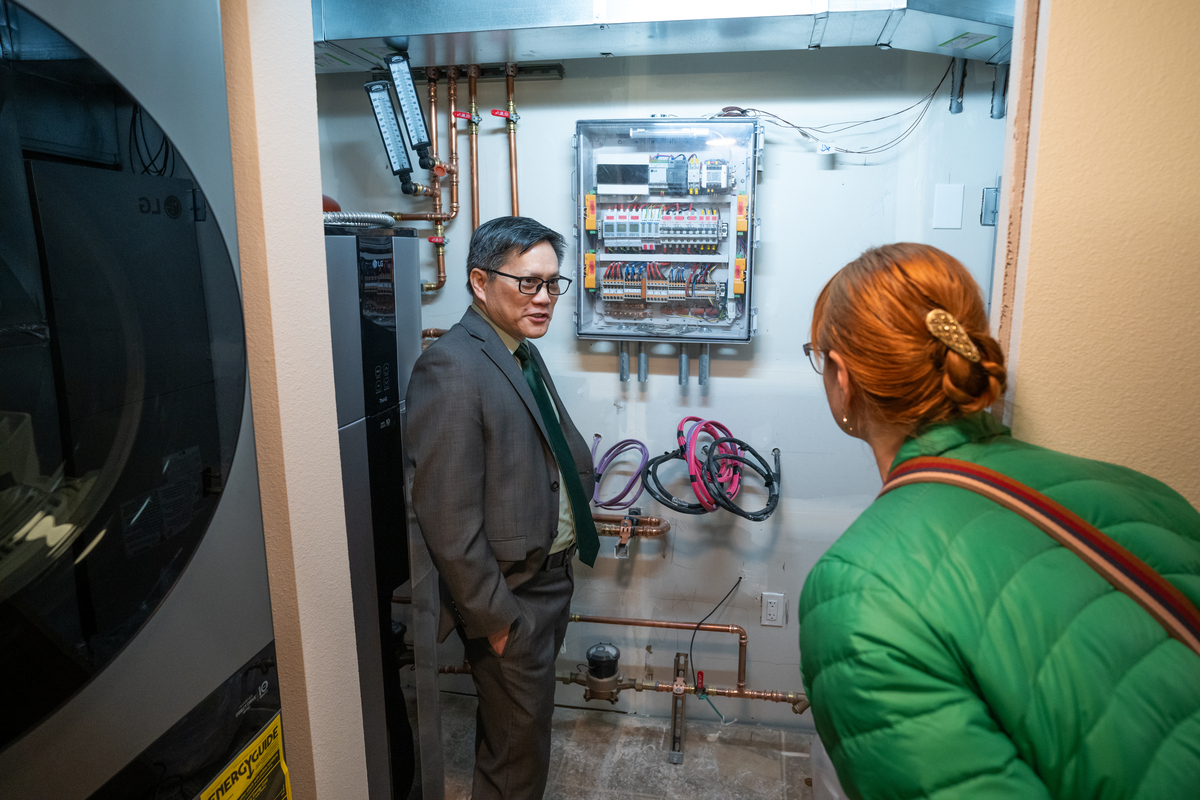 COE Dean Kenrick Mock and Associate Dean for academics Jennifer Brock tour the lab during the ribbon cutting for the UAA College of Engineering's LG Cold Climate Heat Pump Lab.