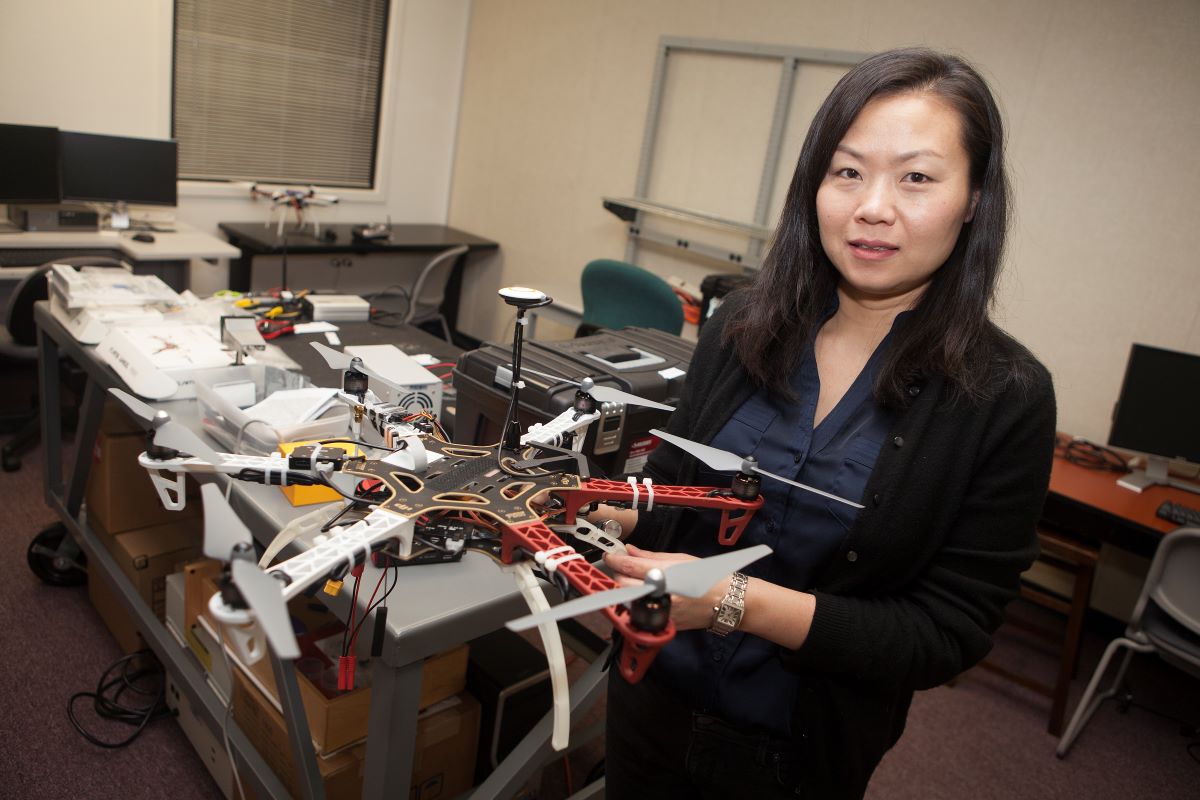 Caixia Wang with a drone