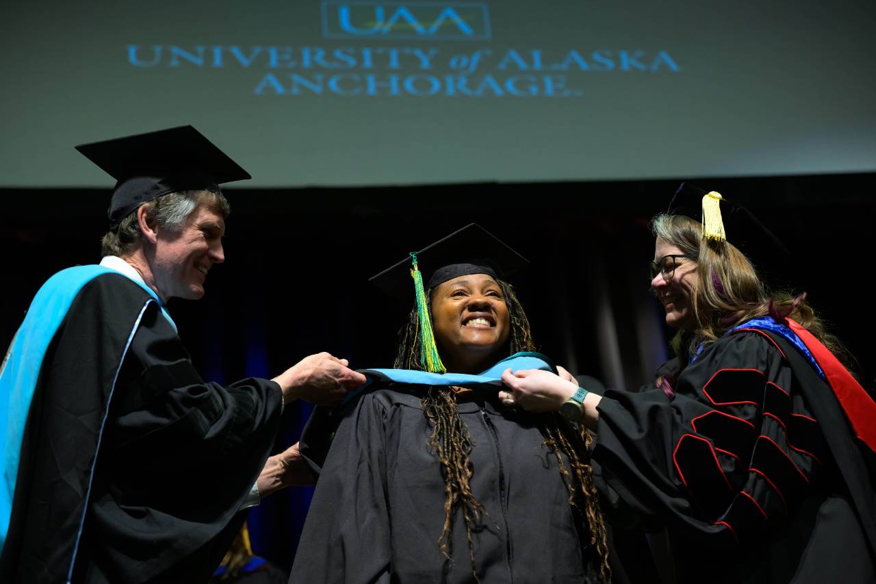 Graduate at Hooding Ceremony