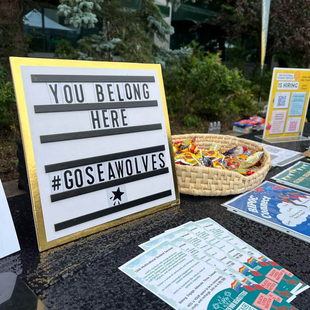 Table with sign saying You Belong Here