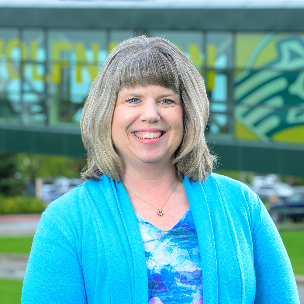 Becky Brokaw on campus outside in the summer