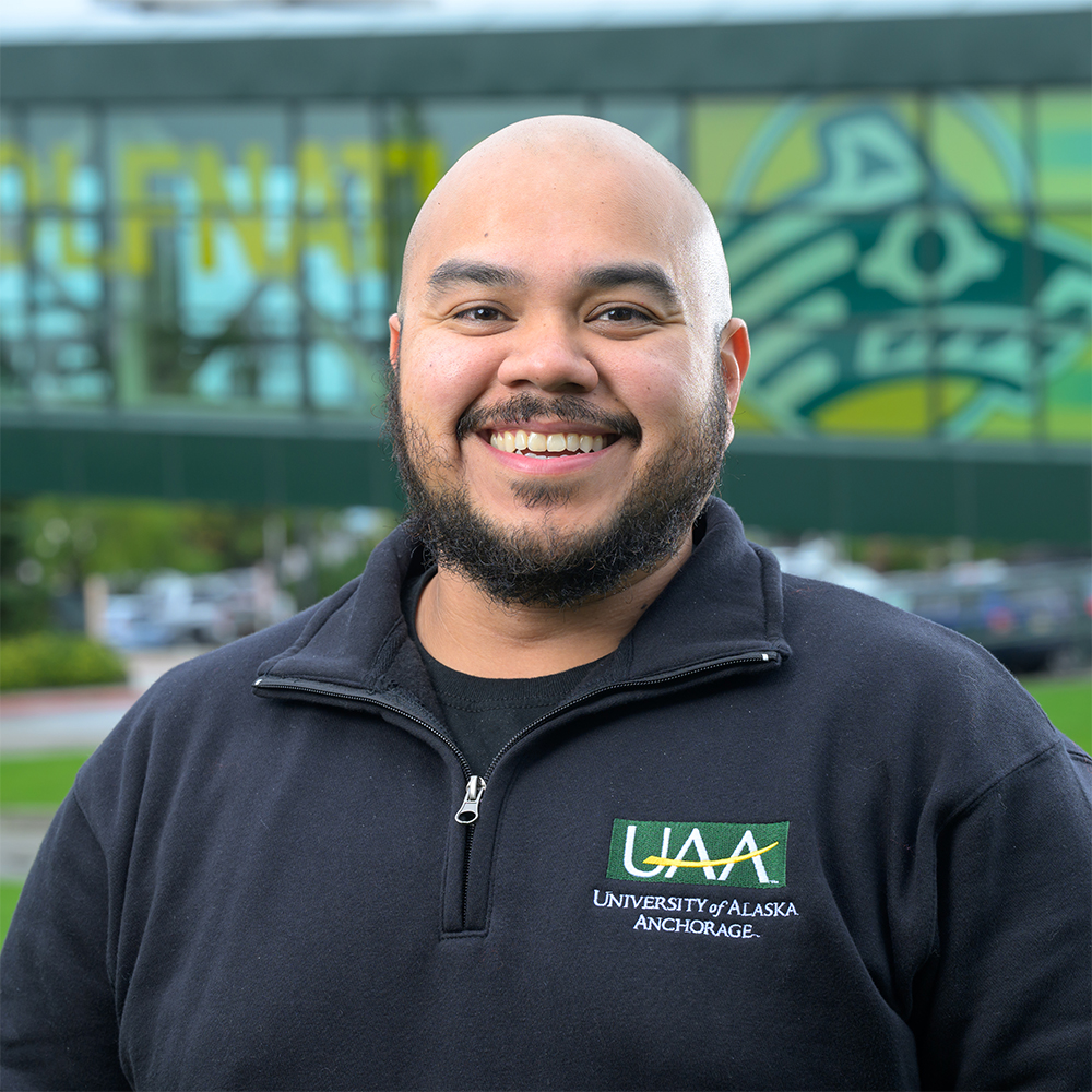 Marc Campanilla on campus outside in the summer